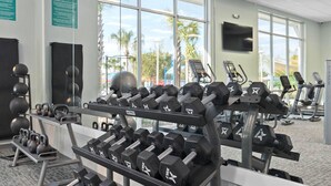 A gym with weightlifting equipment, treadmills, and exercise machines. - 8BR Retreat | Sleep 20 | Theater | Huge Pool & Spa (Davenport)