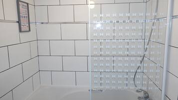 Standard Apartment | Bathroom | Combined shower/bathtub, hair dryer, towels, soap