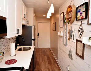 Enjoy cooking in this well-equipped kitchen with a central island and sink.