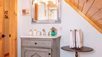 Jetted tub, rainfall showerhead, designer toiletries, hair dryer