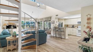 A modern interior with a staircase, a dining area, and a kitchen. - Hidden Dunes Beach Cottage 167- Private Beach Access!- Heated Pool (Miramar Beach)