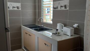 Fridge, microwave, stovetop, coffee/tea maker