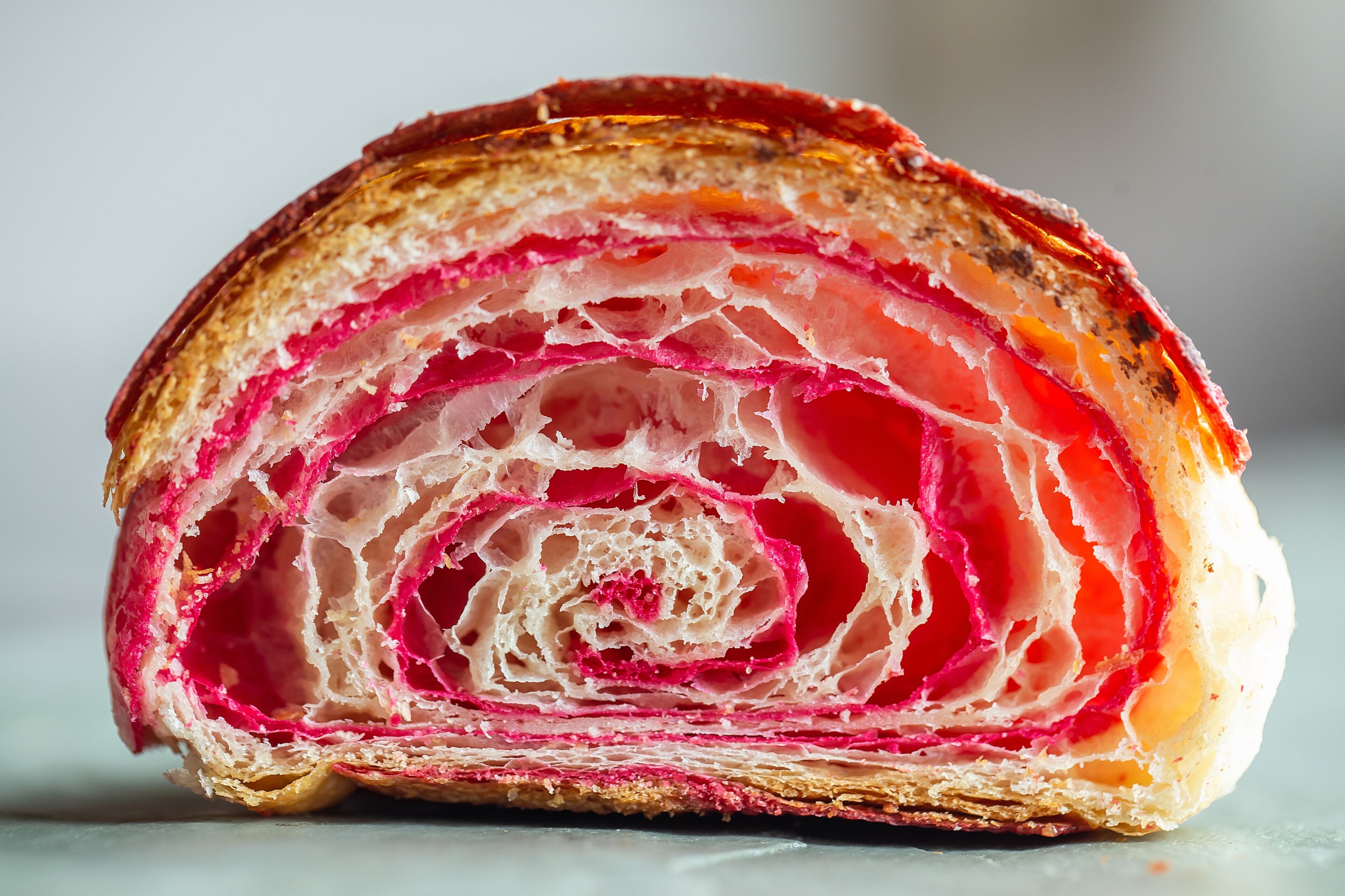 A close-up of a layered pastry with visible filling.