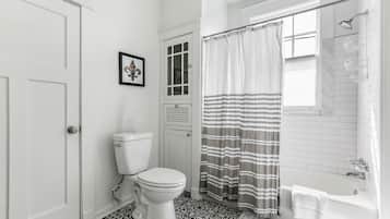 Combined shower/tub, hair dryer, towels, soap