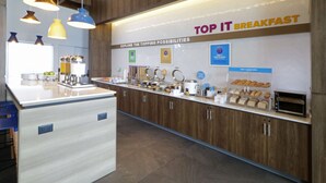 A breakfast area with a counter displaying various food items and a sign reading "TOP IT BREAKFAST". - Tru By Hilton Monterrey Fundidora (Monterrey)