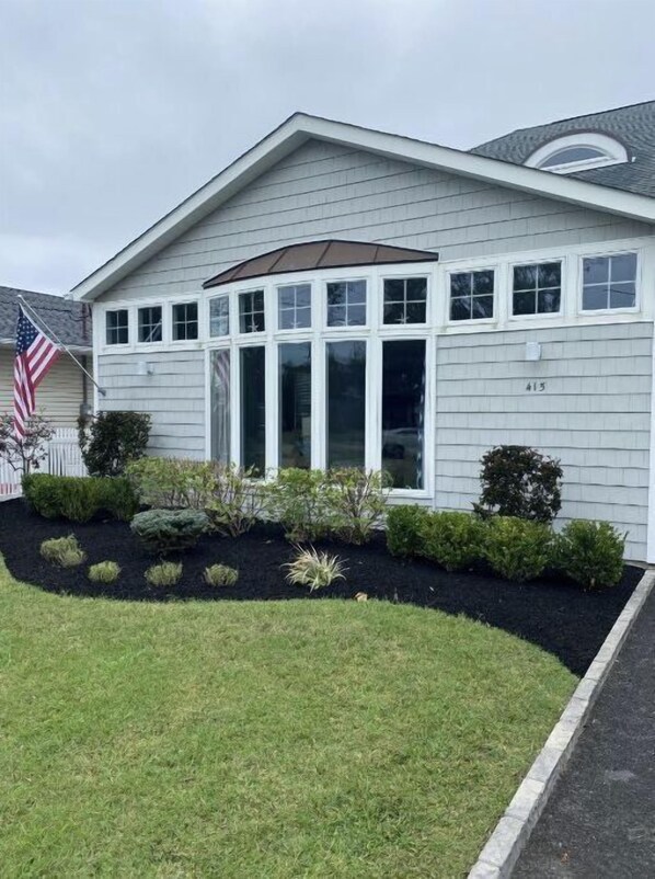A single-story house with a gabled roof, a covered front porch, and a number '415' on the side. - Family Fun Home. 5 Bedroom & Inground Pool !
4 blocks from the Beach ! (Point Pleasant Beach)