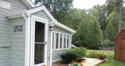 Riverfront Cottage w/ Boat Docking and easy access to Burt Lake