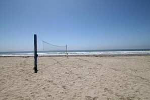 On the beach, beach umbrellas, beach towels - North Coast Village (Oceanside)