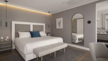 Um quarto moderno com uma cama grande, um banco, uma mesa de cabeceira, um espelho e um criado-mudo.