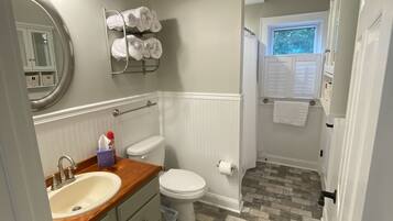 Shower, hair dryer, towels, soap