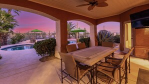 A covered patio with a pool, outdoor seating, and a view of the desert landscape. - ★ Jump in! ★ Luxurious spread in the desert & no annoying neighbors! Comfy beds! (Fountain Hills)