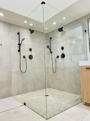 Enjoy a refreshing shower experience with multiple showerheads and a handheld attachment.