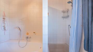 Badkar, hårtork och handdukar