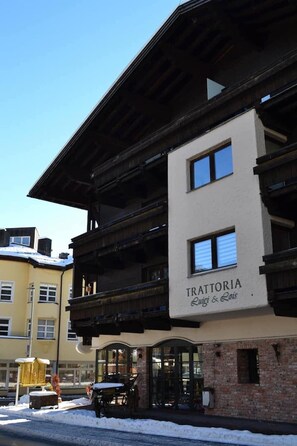 A multi-story building with a sign reading 'TRATTORIA Luigi & Lois.' - Apartment "Andy's Bergblick" with Mountain View, Wi-Fi & Balcony (Leutasch)