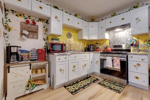Fridge, microwave, stovetop, coffee/tea maker
