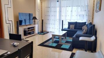 Apartment, 1 Bedroom | Living area | Flat-screen TV