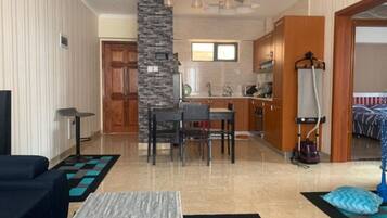 Apartment, 1 Bedroom | Living area | Flat-screen TV