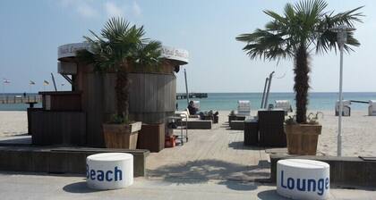 Onirique confort appartement avec sauna, cheminée et chaise de plage