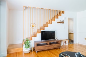 Cozy living space with a flat-screen TV and comfortable seating area.