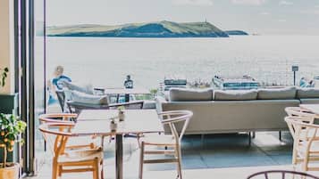 Breakfast, lunch, dinner served; beach views