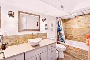 Combined shower/bathtub, hair dryer, towels, soap