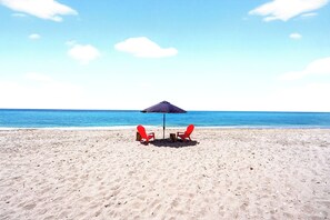 On the beach, sun loungers, beach towels