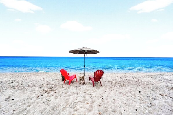 On the beach, sun-loungers, beach towels
