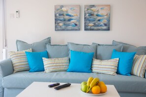 Comfort Apartment | Living area | 32-inch Smart TV with digital channels, TV, Netflix - White Arches Sea View Apt No.1 by TrulyCyprus (Limassol)