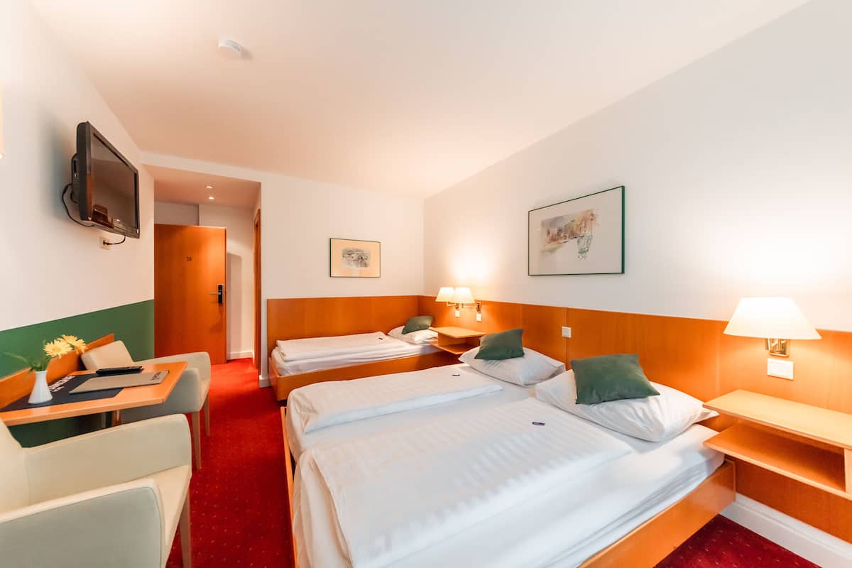 Triple Room | Desk, blackout drapes, cribs/infant beds, free WiFi