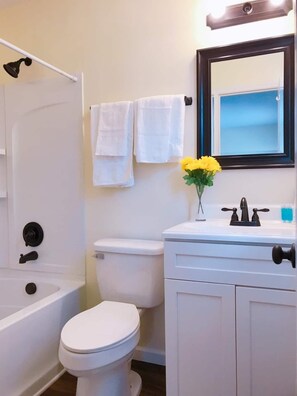 Combined shower/tub, towels, soap, toilet paper