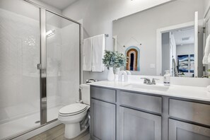 Shower, hair dryer, towels, soap