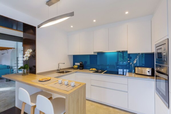 Fridge, oven, dishwasher, dining tables