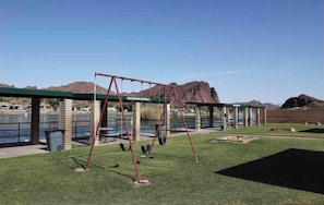Enjoy a serene family-friendly setting with a swing set and scenic views.