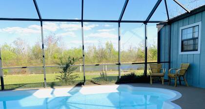 Cozy Tavares home in with heated pool on the canal