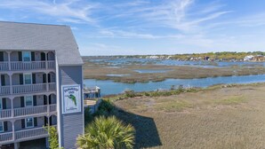 A building with a sign reading "Seawatch Inn" and "The Landing." - Seawatch Inn at the Landing (Murrells Inlet)