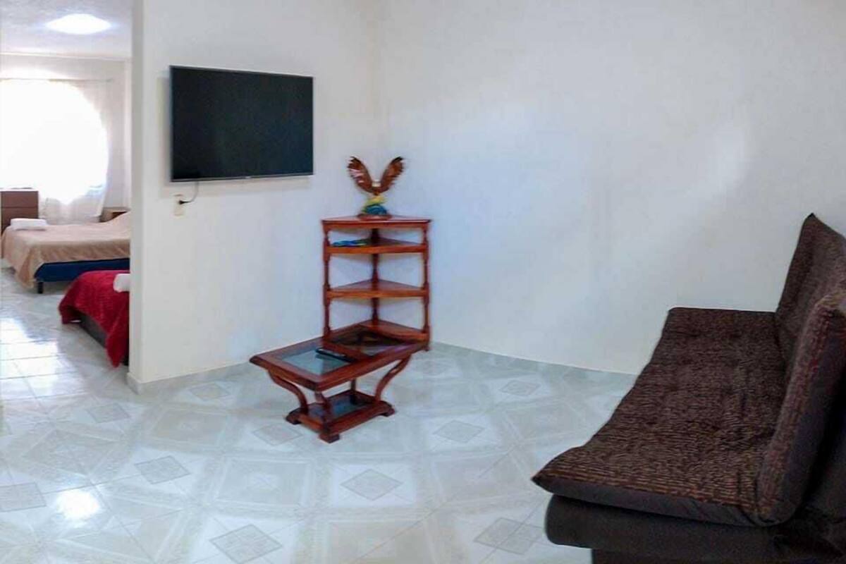Standard Triple Room | Living area | 32-inch Smart TV with digital channels, TV