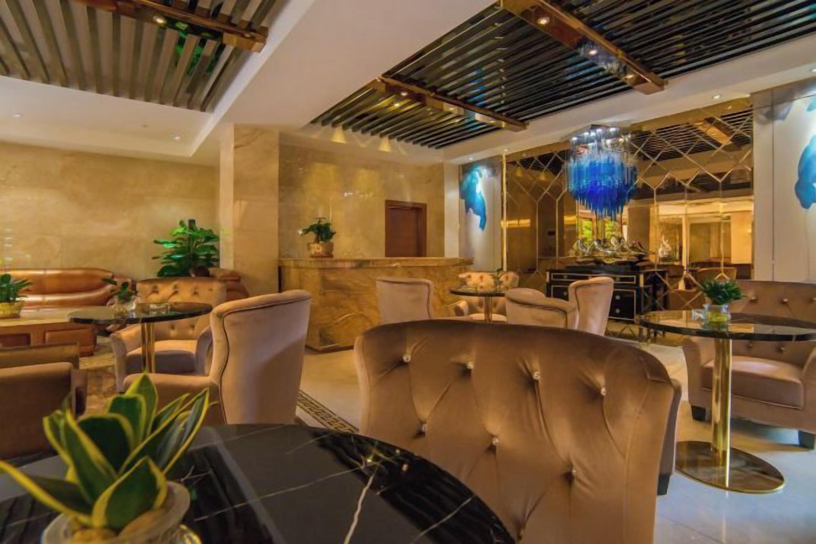 A modern interior with a dining area, seating arrangements, and a bar.