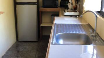 Fridge, stovetop, coffee/tea maker, cookware/dishes/utensils