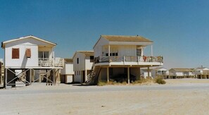 Enjoy expansive views of the surrounding landscape from elevated structures with access to the sandy beach below.