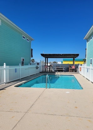 Outdoor pool, a heated pool - Sunset Shores--4 BR/3 BA, Walk to the Beach, Heated Pool, Dogs OK (Port Aransas)