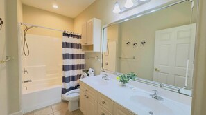 Bathtub, hair dryer, shampoo