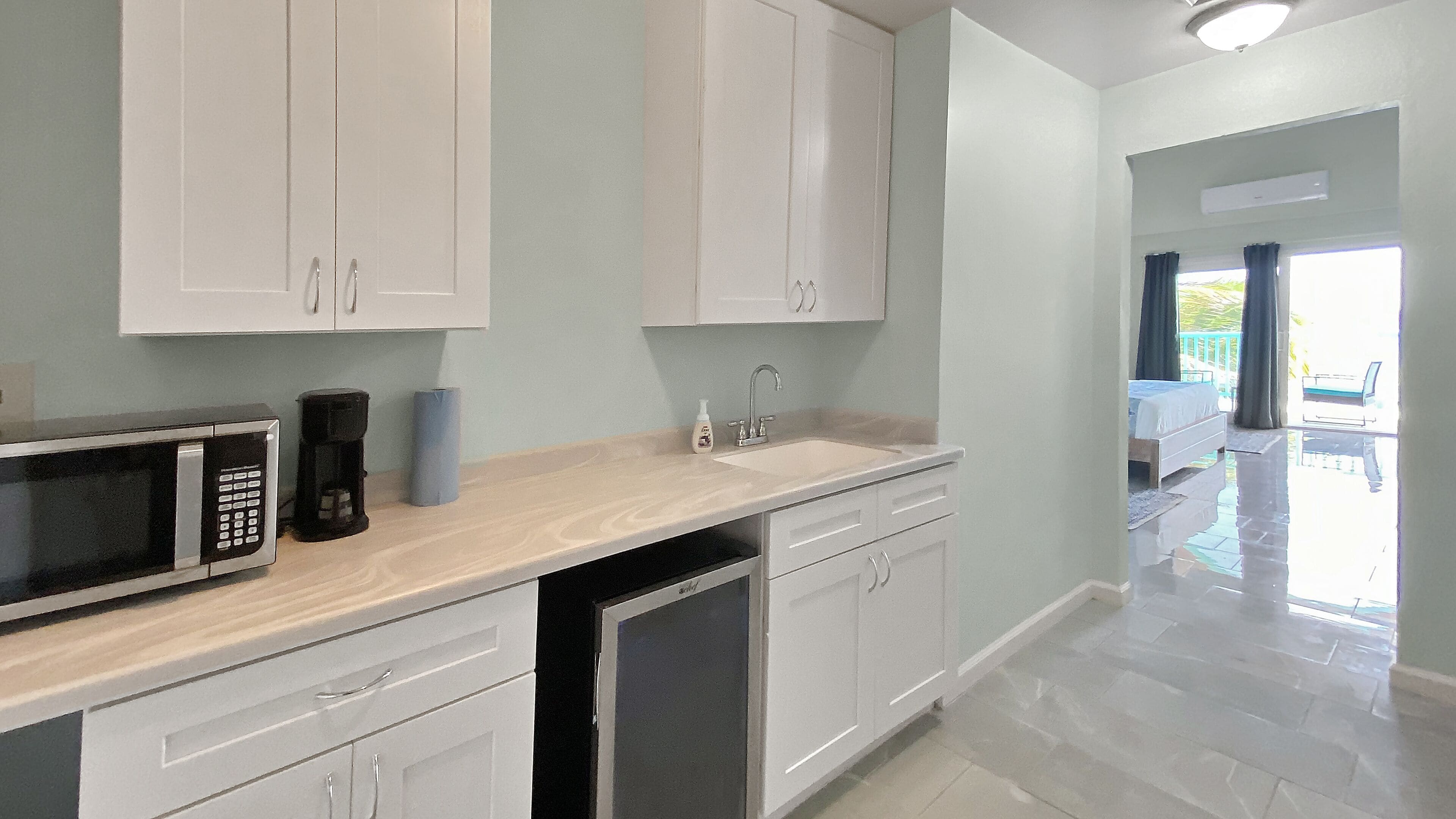 mini-fridge, microwave, coffee/tea maker, high chair