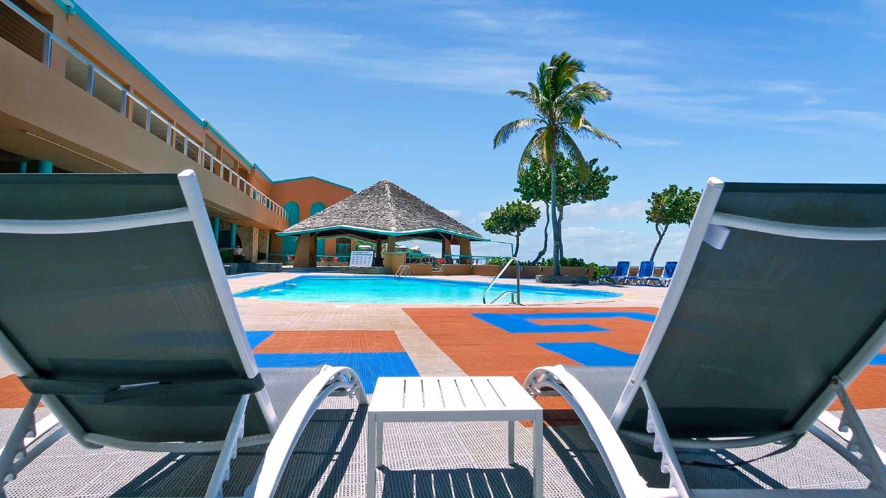 outdoor pool, open 8:00 am to 8:00 pm, pool loungers