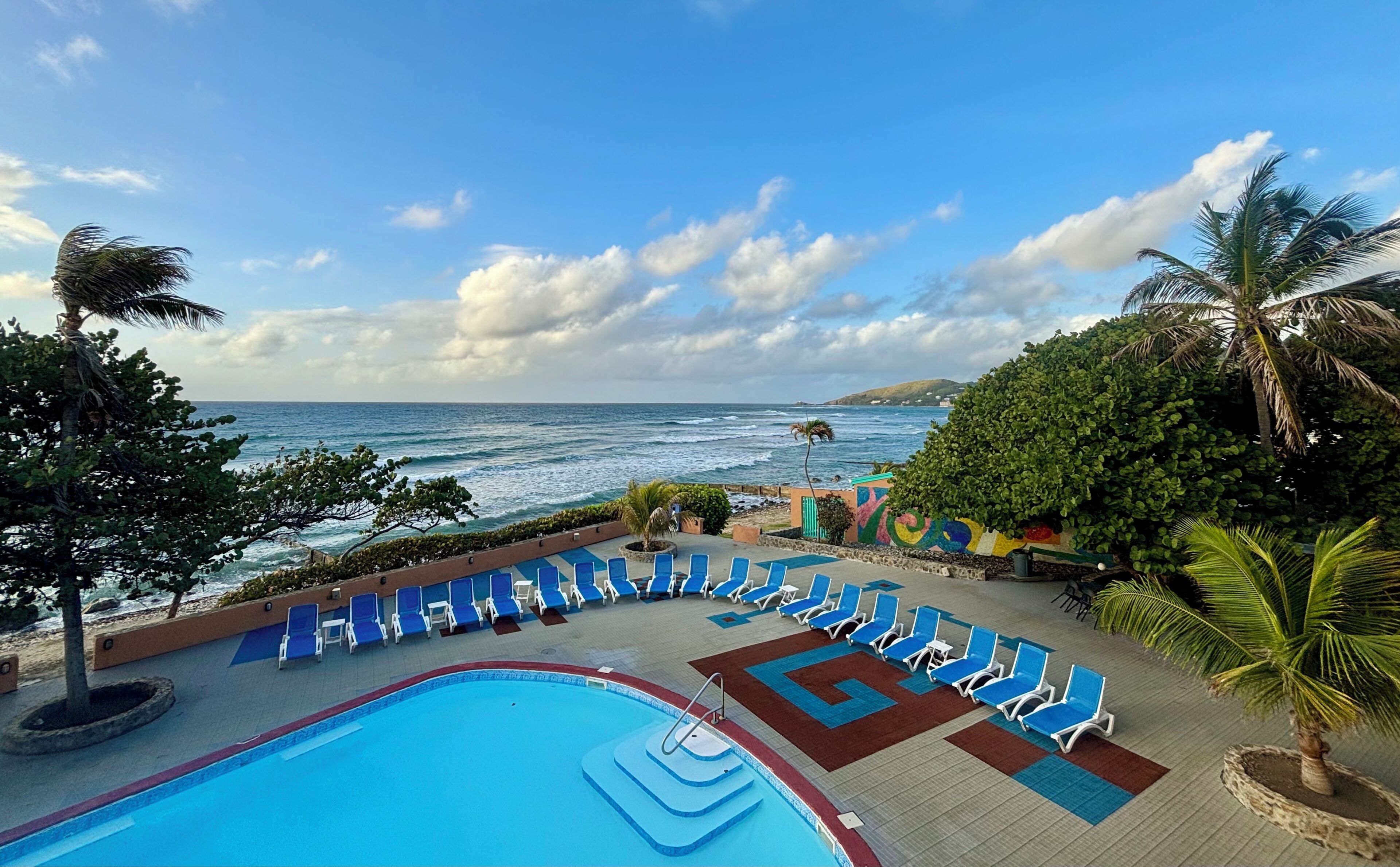 Outdoor pool, open 8:00 AM to 8:00 PM, pool loungers