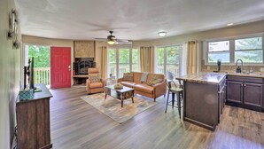 A spacious living area with a sofa, coffee table, and a kitchen island. - 4 Mi to Sugar Mtn Resort! Family-Friendly Retreat (Banner Elk)