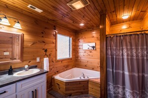 Bathtub, jetted tub, hair dryer, towels