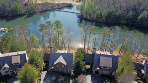 A residential area with houses near a lake, surrounded by trees. - Paradise Retreat - Sip Cocktails by Lake Disharoon, Play Golf & Swim Year-Round (Jasper)
