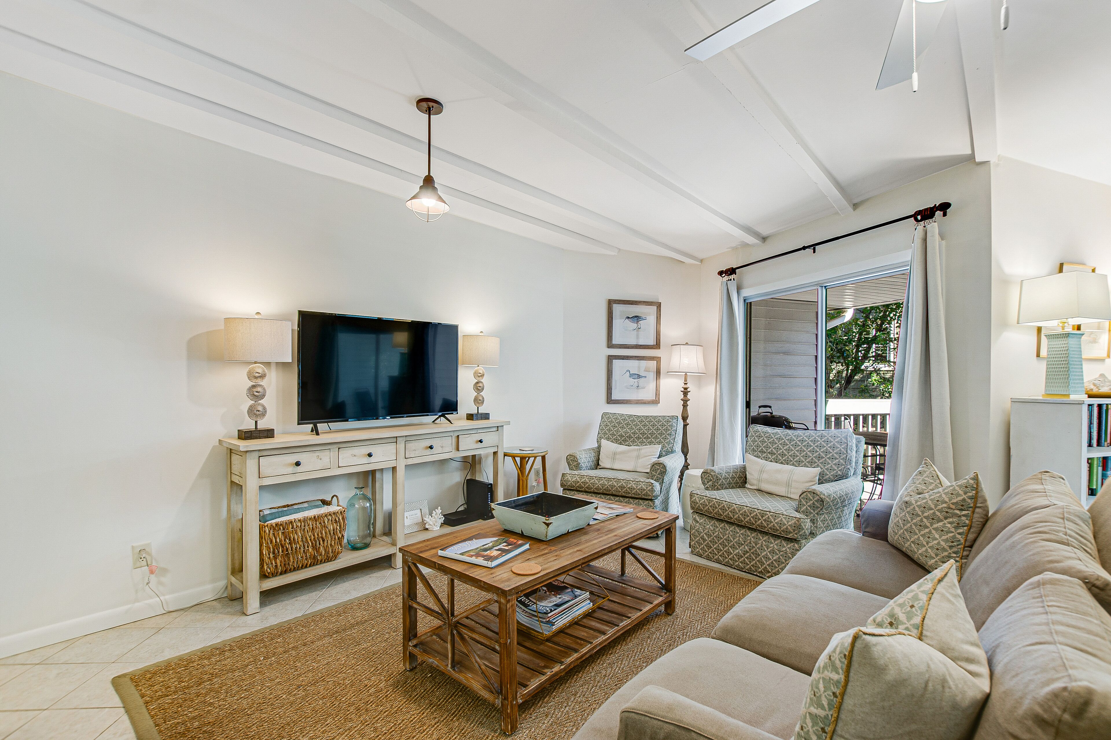 Two-story condo near the ocean with large deck, patio, W/D, & free WiFi