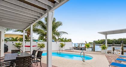 Waterfront home with dock, pool table & private pool - walk to Sombrero Beach
