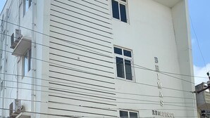 A multi-story building with a sign reading "BIMAS RESIDENCY". - PPH Living Bhimas (Tada)